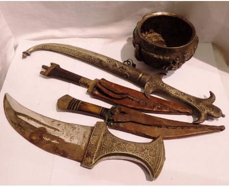Four Middle Eastern Jambiya knives and a white metal bowl (5). P&amp;P Group 3 (£25+VAT for the first lot and £5+VAT for subs