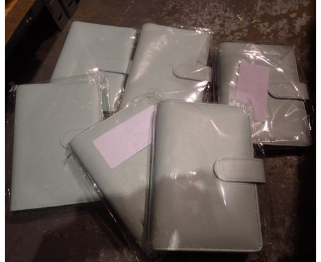 Six new old stock small leather ring binders. P&amp;P Group 2 (£18+VAT for the first lot and £3+VAT for subsequent lots) 