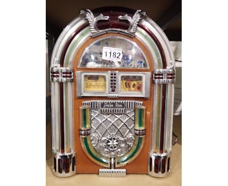 Radio and cassette player in the style of a retro jukebox, H: 36 cm. All electrical items in this lot have been PAT tested fo