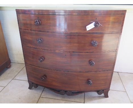 A 19th Century mahogany five drawer bow fronted chest on splayed bracket feet, united by a decorative apron, 115cm H x 61xm D