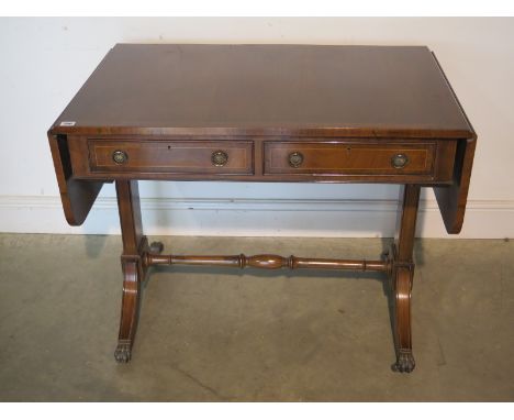 A 20th Century mahogany sofa table in good condition - 150cm W x 62cm D 