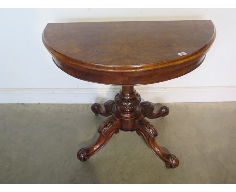 A Victorian walnut inlaid demi-lune swivel top fold over card table - in clean restored condition - 89cm wide 