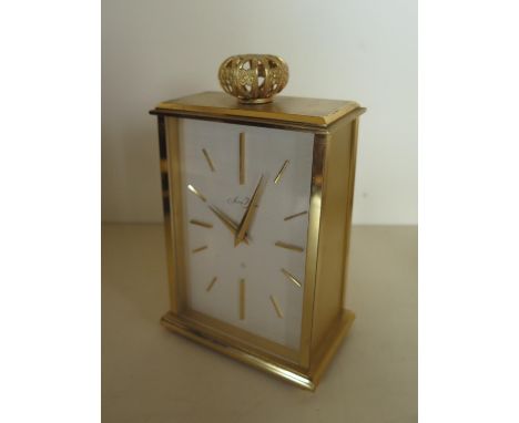 A Saint Blaise gilt metal mantle clock, manual wind in clean running condition - 14cm x 9cm 