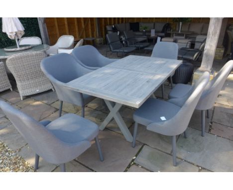 A Bramblecrest Monterey ceramic 155 table and 6 all weather chairs