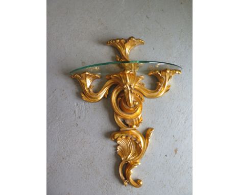 A gilt and glass wall shelf - 65cm x 51cm 