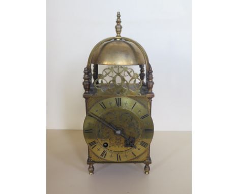 A brass lantern clock with an English balance movement - 33cm tall, running in saleroom 