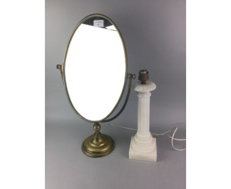 BRASS OVAL DRESSING GLASS, 58cm high, along with a brass door knocker, a composite column table lamp and a small hardwood sta