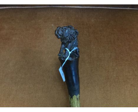 SIMULATED BAMBOO WALKING STICK, with carved lion handle, 100 cm long
