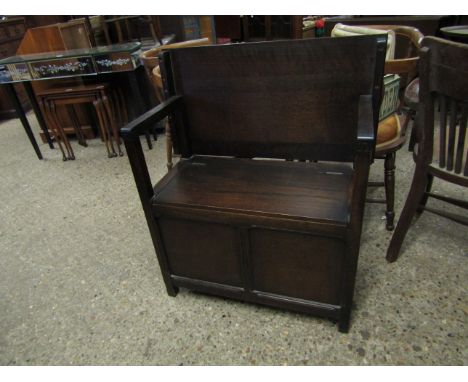 MID 20TH CENTURY MONKS BENCH WITH LIFT UP SEATS AND TWO PANEL FRONT 