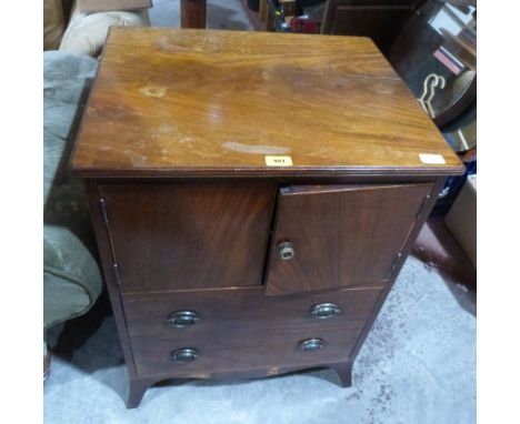 A George III mahogany night commode, enclosed by a pair of doors over a deep drawer on splayed bracket feet. 23' wide