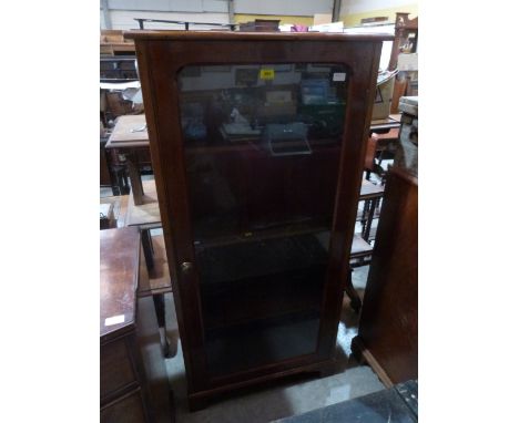 An early 20th century mahogany bookcase enclosed by a glazed door on bracket feet. 28' wide