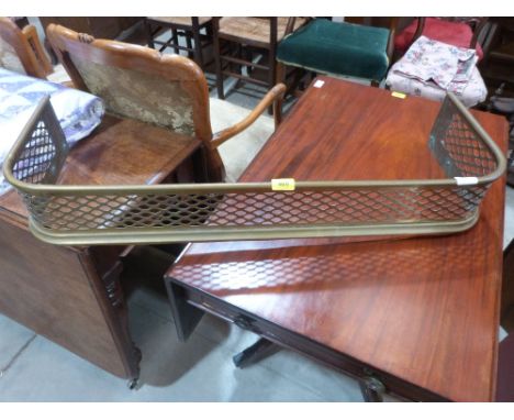 A brass fender, 37' wide