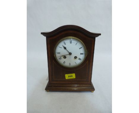 An Edward VII mahogany and line inlaid mantle clock with French 8 day brass drum movement. 10' high