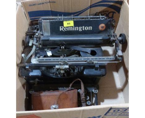 A Remington typewriter and a leather cased kodak camera
