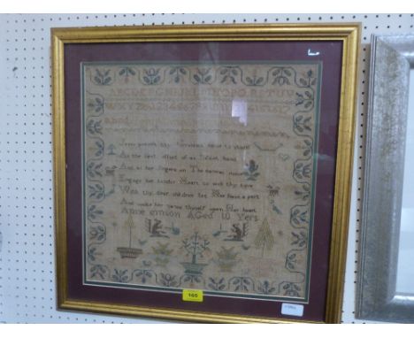 A 19th century needlework sampler worked by Anne Emson aged 10 years with religious verse, alpha-numeric sequence, squirrels,