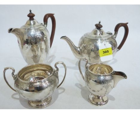 A George V four piece silver tea service, by Walker &amp; Hall, comprising teapot, coffee pot, sucrier and cream jug with bri