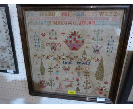 A 19th century needlework sampler worked by Sarah Powell, with alpha-numeric sequence, animals, trees, bowls of fruit, crown 