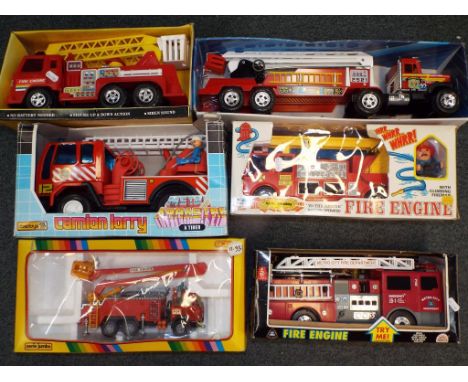 Six large scale fire engines in original boxes, friction powered and battery operated to include a fire engine by Lido Toy Co