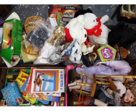 A large mixed lot to contain a quantity of dressed dolls, soft toys, an electronic Furby, a quantity of Harry Potter items in