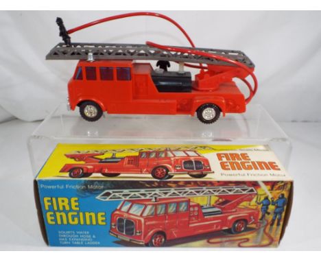 Hong Kong made plastic friction motor fire engine with squirting water and expanding turn table ladder 20 cm (l), model appea