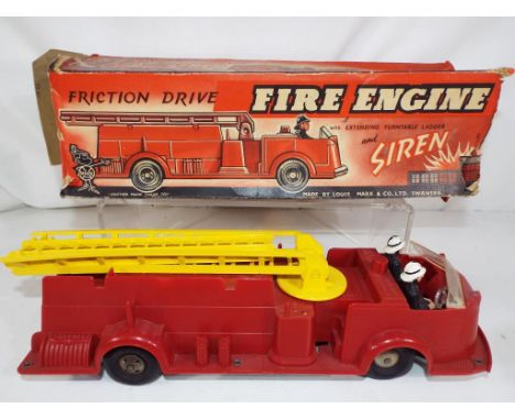 Marx Toys - A Louis Marx friction drive fire engine with extending turntable ladder and siren, driver and passenger present, 