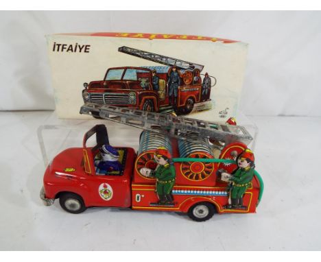 A tin-plate 1970s NE - Kur Turkey (ITFAIYE) tin-plate fire truck / engine with friction drive, model No. 787403921, boxed