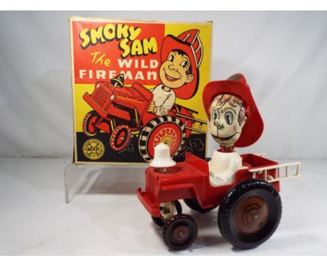 A 1950s clockwork Smoky Sam The Wild Fireman by Marx Toys tin-plate and plastic in original box, model appears in mint condit