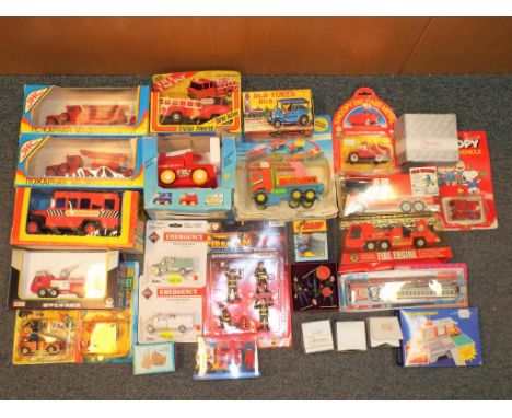 A very large collection of emergency fire vehicles to include Boley, Old Timer double friction bus, fireman play squad figure