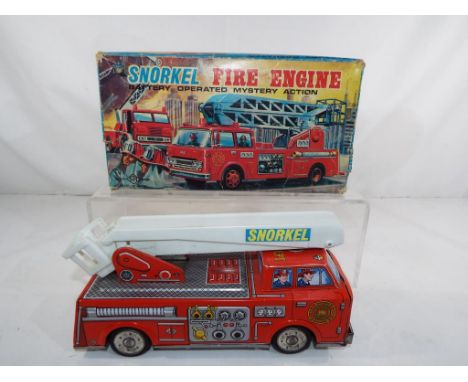 A battery operated tin-plate and plastic Snorkel Fire Engine by Trade S.H. Mark, Japan, vehicle appears in excellent + condit