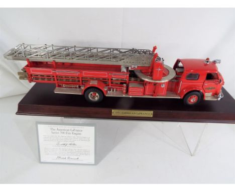 Franklin Mint - an American LaFrance series 700 Fire Engine, 1:32 scale diecast model on plinth with certificate and box, app