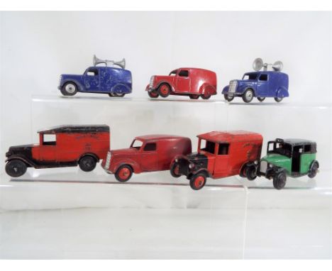 Dinky - seven unboxed diecast commercial vehicles, comprising an Austin Taxi, two Royal Mail vans, two red Austin vans and tw