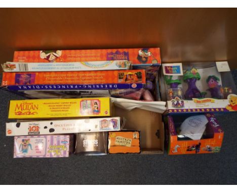 A vintage electronic Furby in original box, a Winnie the Pooh Tiny Collection 100 Acre Wood playset, Disney's Mulan playset, 