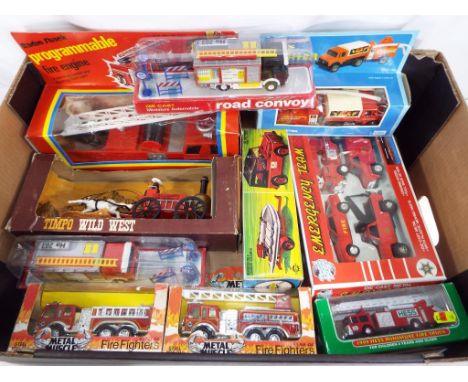 A collection of predominantly diecast model emergency fire service vehicles to include a Radio Shack programmable fire engine