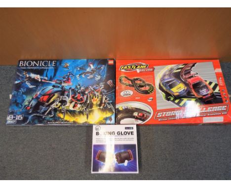 A Storm Challenge Fastlane electric racing game in original box, Lego Bionicle Toa Terrain crawler model 8927 in original box