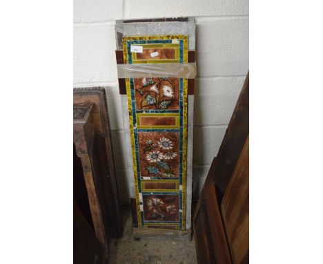 A pair of Victorian fireside tile panels decorated with flowers, 97cm high including backing