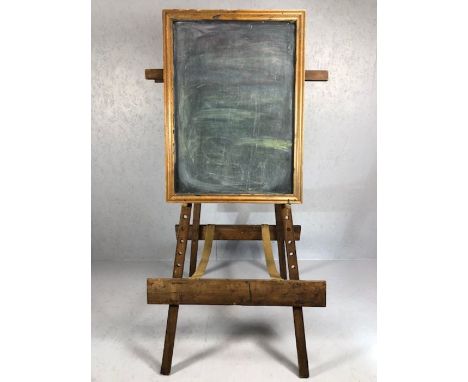 Large wooden vintage easel with fabric straps and supporting a wooden framed blackboard, total height approx 180cm