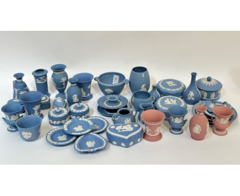 A group of Wedgwood Jasperware pottery, comprising three pink pieces, trinket boxes, vases, miniature urns, bottles, a pair o