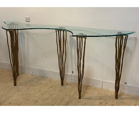 Domus nova, an Italian designer console table, the top of abstract form with moulded edge raised on gilt wrought iron support