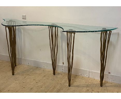 Domus nova, an Italian designer console table, the top of abstract form with moulded edge raised on gilt wrought iron support