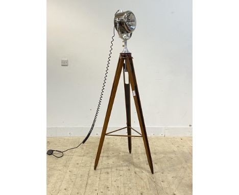 A 1930's style Half Mile Ray Searchlight Floor Lamp raised on mahogany tripod, with makers badge inscribed  The Searchlight C