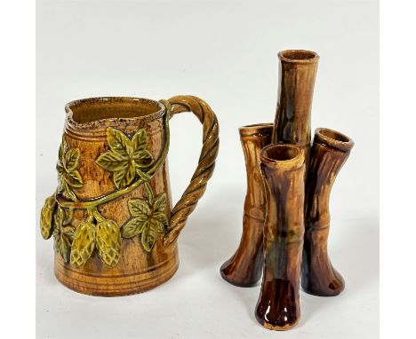 An Edwardian pottery jug with rope pattern scroll handle to side and applied fruit and leaf decoration (h: 14cm x 10cm) and a