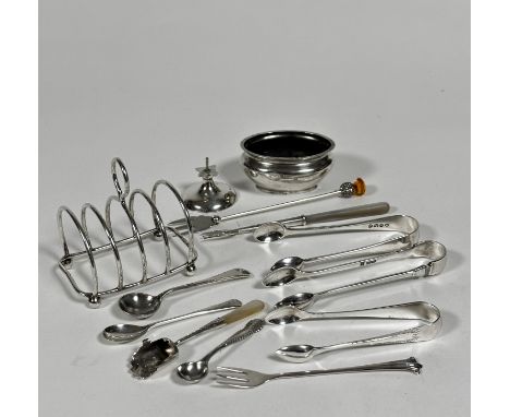 A silver four division miniature toast rack raised on bun feet, (h: 7cm x 6.5cm) marks rubbed, a pair of Sheffield silver sug