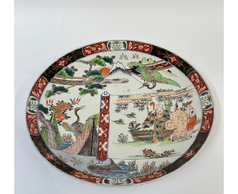 A 20th century Japanese porcelain dish depicting mount Fuji and longevity symbols of cranes and pine trees, and a Chinese scr