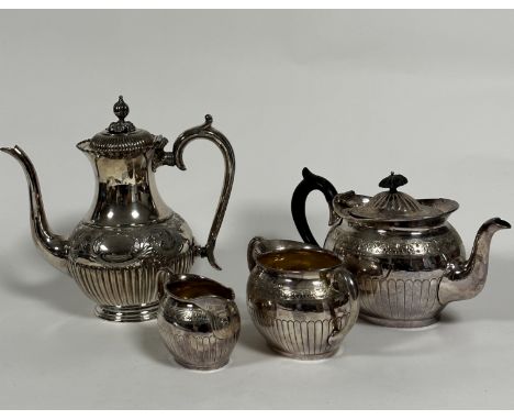 An Epns oval engraved lob style three piece tea service including two handled sugar basin, teapot and milk ewer, an Edwardian