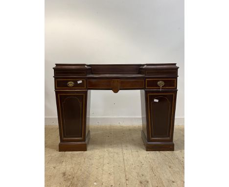 An Edwardian Sheraton revival mahogany twin pedestal sideboard, inlaid with satinwood cross bands and ebony and boxwood strin