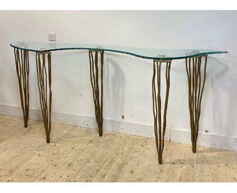 Domus nova, an Italian designer console table, the top of abstract form with moulded edge raised on gilt wrought iron support