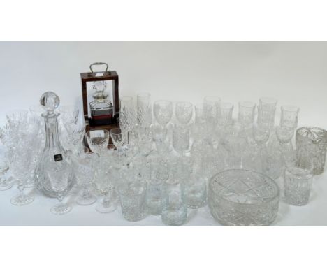 A large collection of crystal comprising a full tantalus/decanter, a large bowl, jug, a Royal Doulton decanter, seven thistle