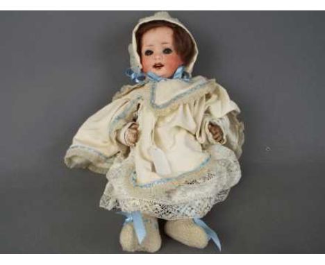 Heubach Doll - a ceramic faced Heubach doll with jointed arms and legs, composition body, ceramic face with sleeping blue eye
