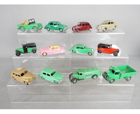 Dinky Toys - A fleet of 12 unboxed diecast vehicles by Dinky Toys. Lot includes Dinky Toys 36g Austin Taxi; #340 Land Rover; 