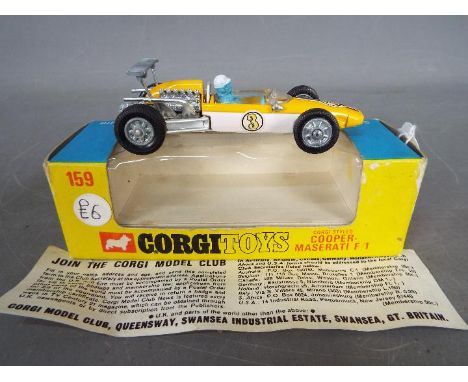 Corgi - A boxed Corgi #159 Cooper Maserati Formula 1 Racing Car. The model in yellow and white, with cast hubs, RN 3, blue an